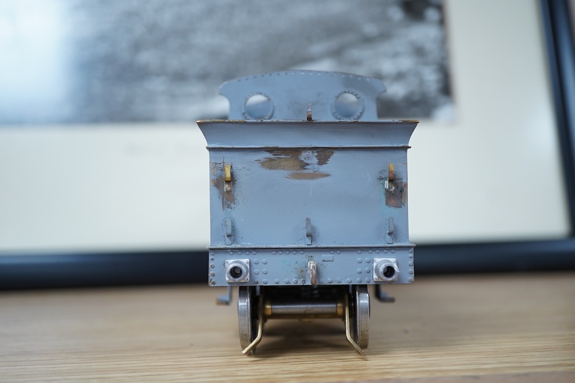 Eleven 0 gauge model railway items including; a bogie stake wagon, two mineral wagons, a North British coal wagon and two further open wagons, a partly constructed brake van, together with a Lima LMS 4F locomotive, two L